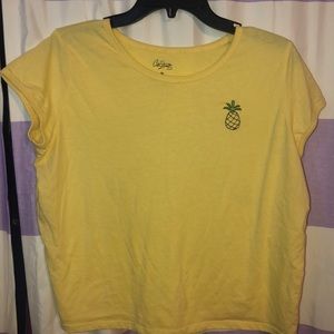 a shirt with a pineapple on it .